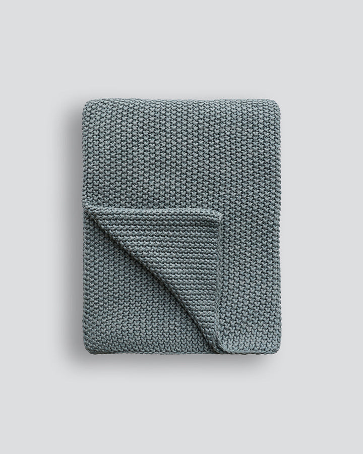 Devon Throw Retreat into the comfort of this calming, sage toned throw. A classic and versatile accessory to any room, the contemporary design of the Devon offers an unparalleled sense of comfort and style. Knitted from 100% organic cotton, the medium wei