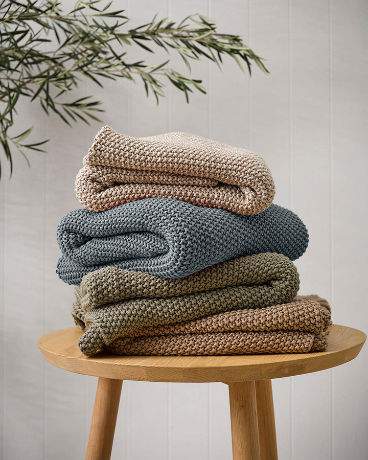 Devon Throw Retreat into the comfort of this calming, sage toned throw. A classic and versatile accessory to any room, the contemporary design of the Devon offers an unparalleled sense of comfort and style. Knitted from 100% organic cotton, the medium wei