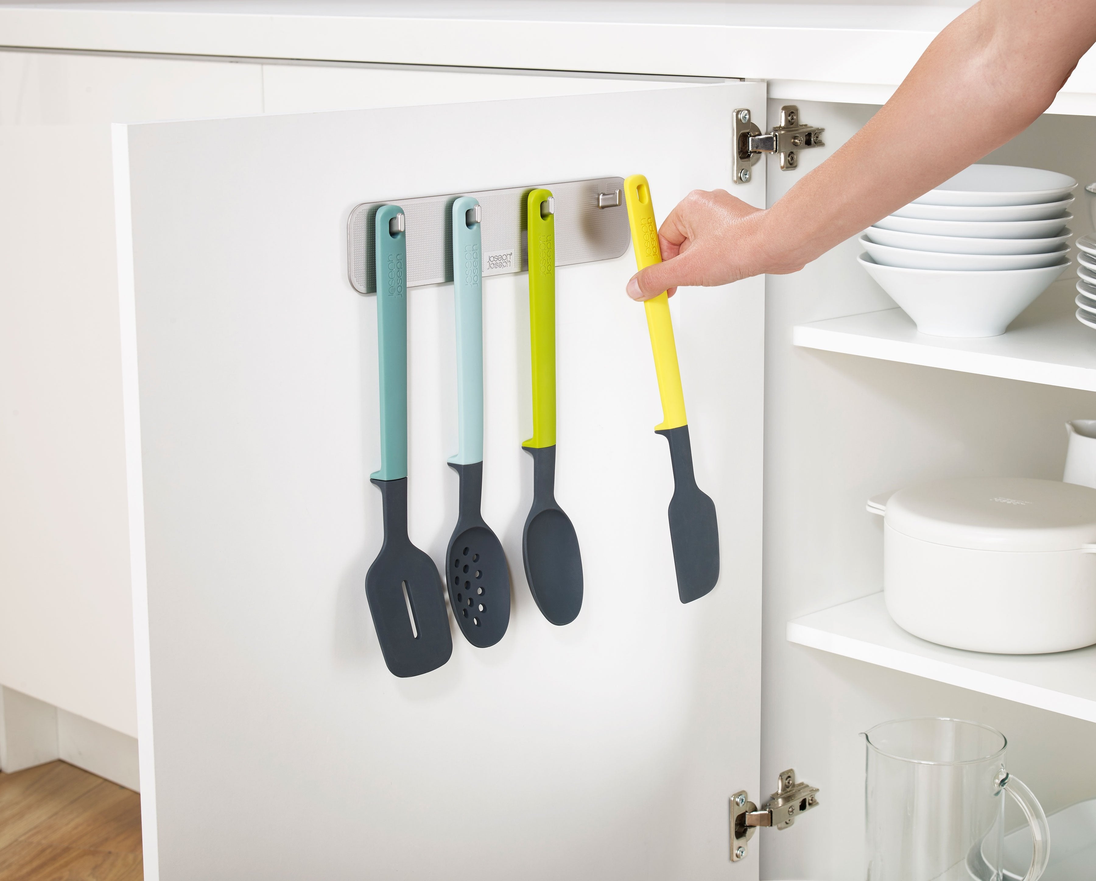 BEON.COM.AU  This clever 4-piece utensil set makes maximum use of the space inside your cupboard by storing on the back of the door.  Slimline rack ideal for mounting in narrow spaces Easy, tool-free installation using strong 3M™ VHB™ adhesive tape Elevate™ utensils feature integrated tool rests to prevent t... Joseph Joseph at BEON.COM.AU