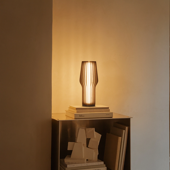 Buy Eva Solo Radiant Table Lamp in Smoke Table Lamps Add a touch of hygge to any space with the Eva Solo Cordless Table Lamp. Featuring a smoke-coloured design, this lamp is ideal for brightening up shelves, balconies, and patios without the hassle of cor