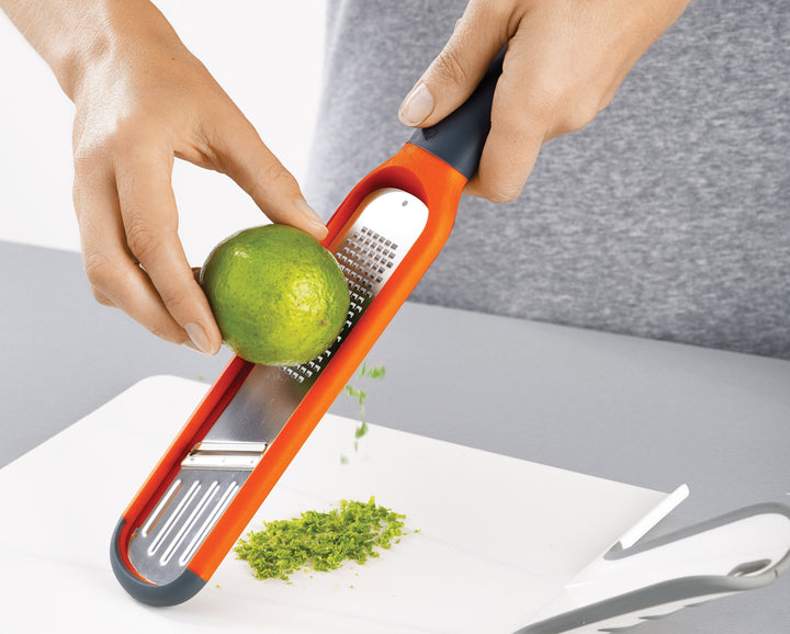 Buy online & save Handi-Grate™ 2-in-1 Mini Grater & Slicer | BEON.COM.AU  This beautifully compact gadget has blades on either side of its design allowing you to easily grate or slice small foods such as garlic, ginger and mini vegetables.  Razor sharp, stainless-steel blades for grating and slicing Ergonomic handle, non-slip tip and sliding finger guard for added saf... Joseph Joseph at BEON.COM.AU