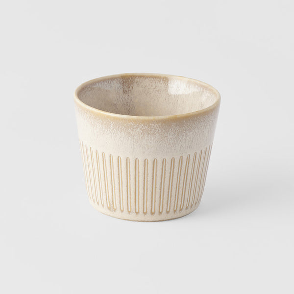 Save on Soba Cup / Alabaster Glaze Made in Japan at BEON. A small cup featuring a simple line pattern embossed on a soft alabaster white glaze.8.5cm diameter6cm heightMade of 'Minoyaki' porcelain, fired at a high temperature and hand finished in Gifu prefecture, Japan. General information & care instructions Our tableware is food safe and can, with some care, be used in the oven, microwave and dishwasher. Sudden changes in temperature (eg. from freezer to oven) are likely to cause thermal shock, which will