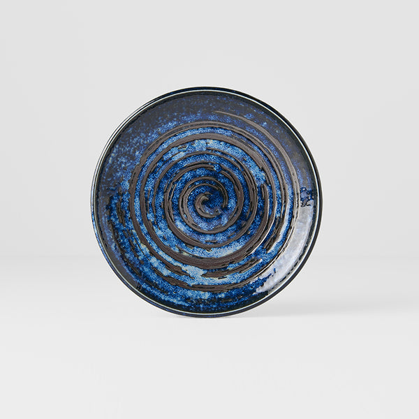 Save on Tapas Plate 17cm / Copper Swirl Glaze Made in Japan at BEON. The Copper Swirl range is designed and made in Gifu prefecture, Japan.17cm diameterMade of 'Minoyaki' porcelain, fired at a high temperature and hand finished in Gifu prefecture, Japan. The Copper Swirl range features a swirling brushstroke pattern debossed into an indigo blue background. Perfect for rustic seafood dishes! The kiln has over 70 skilled craftspeople. They work with a large variety of glazes and use a unique hand-finishing te