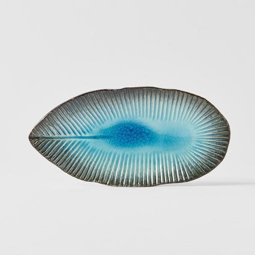 Save on Oval Plate Leaf Shape / Sky Blue Glaze Made in Japan at BEON. The Sky Blue range is designed and made at the Takai Kiln in Gifu prefecture, Japan.21cm length10.5cm widthMade of 'Minoyaki' porcelain, fired at a high temperature and hand finished at the Takai kiln in Gifu prefecture, Japan. The Sky-Blue range consists of organic shapes inspired by the mountainous alpine region of Gifu prefecture. The glaze is fired at low temperatures to create a unique 'crackle' effect over a deep and vibrant blue ba