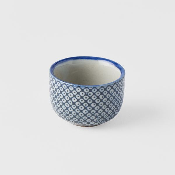 Save on Sake Cup 30ml / Shibori Pattern Made in Japan at BEON. The Shibori range is designed and made at the Ko family kiln in Gifu prefecture, Japan.30ml capacityMade of 'Minoyaki' porcelain and hand finished at the Ko kiln in Gifu prefecture, Japan. Featuring a traditional 'Shibori' pattern in a Japanese indigo blue on a warm white background. Shibori is an ancient method of dying cloth. It represents the spotted back of a fawn. Creating this fabric pattern is very labour intensive and gives special value