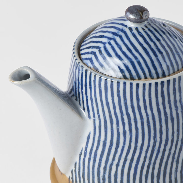 Save on Teapot 400ml / Wave Glaze Made in Japan at BEON. The Wave range is designed and made at the Ko family kiln in Gifu prefecture, Japan.12.5cm height400ml capacityMade of 'Minoyaki' porcelain and hand finished at the Ko kiln in Gifu prefecture, Japan. The Ko Family kiln specialises in crafting small items that require patience and care. Tiny dishes, tea and sake cups plus their popular single flower vases can always be seen lined up on drying shelves in various stages of production. Ko-san's parents ha