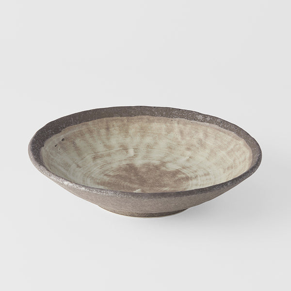 Save on Shallow Open Bowl 24cm / Nin Rin Glaze Made in Japan at BEON. The Nin Rin range is designed and made in Gifu prefecture, Japan.24cm diameter5.5cm heightMade of 'Minoyaki' porcelain, fired at a high temperature and hand finished in Gifu prefecture, Japan. The Nin Rin range features a circular sweep of golden ochre over the signature 'Earth' glaze. No two pieces are the same due to a unique hand glazing technique used to create the swirling pattern. The kiln has over 70 skilled craftspeople. They work