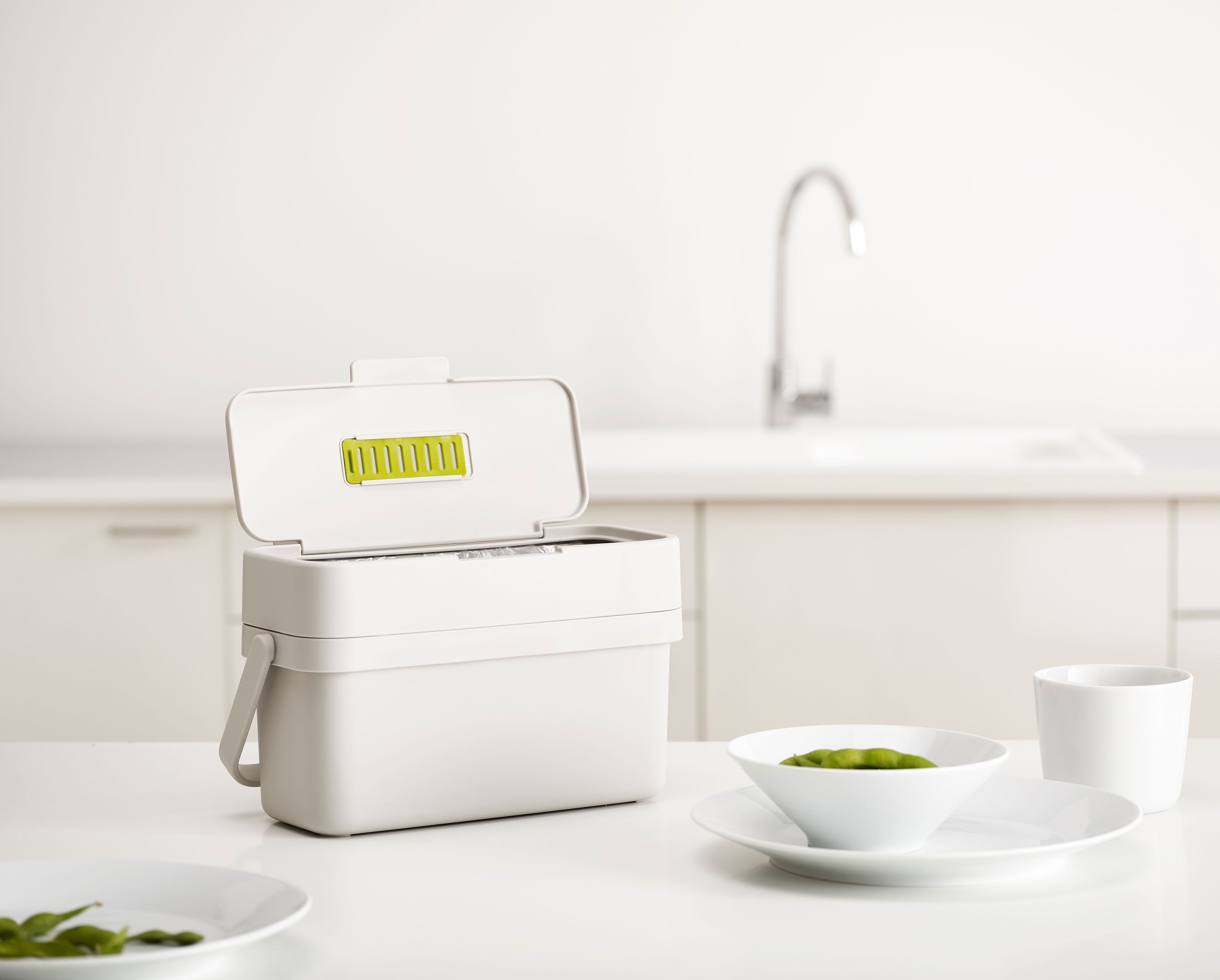 BEON.COM.AU  This slimline food waste caddy is designed to make collecting food scraps easier as it features a convenient flip-up lid and extra wide opening.  Wide aperture makes scraping food from plates easier Adjustable air vent: open - helps reduce moisture and odour build-up; closed - provides insect ba... Joseph Joseph at BEON.COM.AU