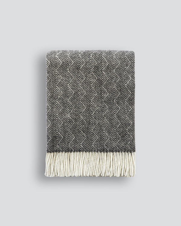 Lana Throw Add a subtle, elegant accent to your space with the feather-style design of the Lana. Woven from 100% New Zealand wool, the soft, lightweight weave drapes beautifully, while the refined charcoal colourway adds a feeling of calm composure. Austr