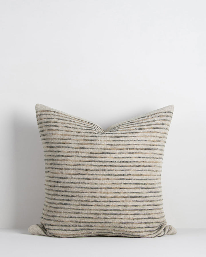 Luigi Cushion Soothe your senses with this space-dyed cushion in classic blue, white and natural linen hues. Handcrafted by artisan makers, this understated, textural design invites us to touch, rest and slow down. Coordinate with natural and cloudburst c