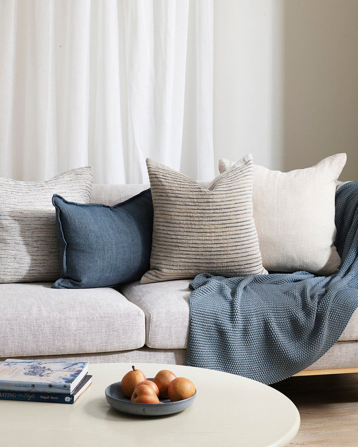 Luigi Cushion Soothe your senses with this space-dyed cushion in classic blue, white and natural linen hues. Handcrafted by artisan makers, this understated, textural design invites us to touch, rest and slow down. Coordinate with natural and cloudburst c