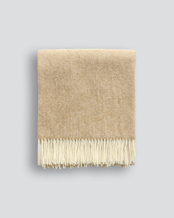 Martinborough Throw Featuring a sophisticated twill weave, classic design is celebrated in this luxurious, pure wool throw. Locally crafted from wool grown in the Hawkeâ€™s Bay, the timeless design and natural olive tone creates a reassuring sense of warm
