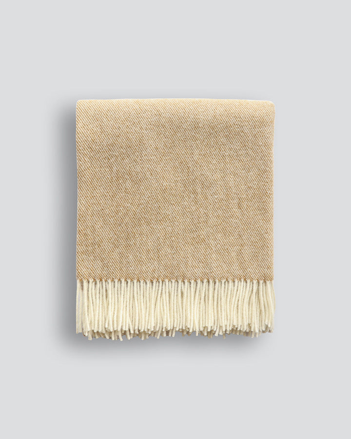 Martinborough Throw Featuring a sophisticated twill weave, classic design is celebrated in this luxurious, pure wool throw. Locally crafted from wool grown in the Hawkeâ€™s Bay, the timeless design and natural olive tone creates a reassuring sense of warm