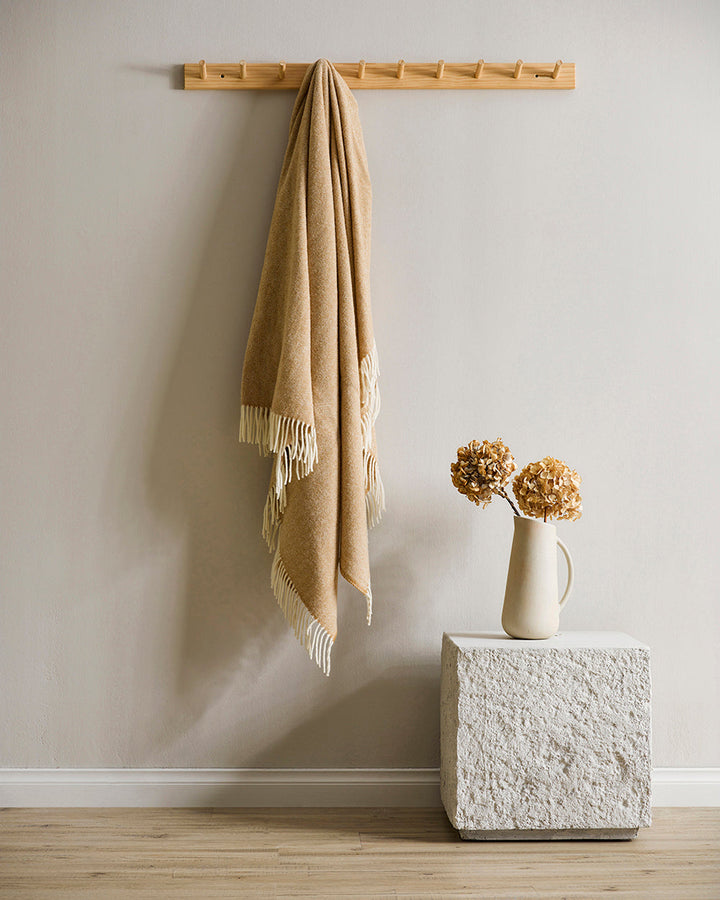 Martinborough Throw Featuring a sophisticated twill weave, classic design is celebrated in this luxurious, pure wool throw. Locally crafted from wool grown in the Hawkeâ€™s Bay, the timeless design and natural olive tone creates a reassuring sense of warm