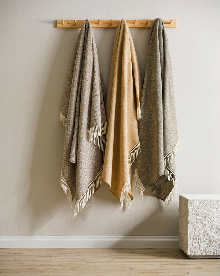 Martinborough Throw Featuring a sophisticated twill weave, classic design is celebrated in this luxurious, pure wool throw. Locally crafted from wool grown in the Hawkeâ€™s Bay, the timeless design and natural olive tone creates a reassuring sense of warm