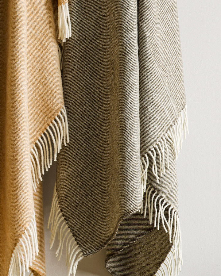 Martinborough Throw Featuring a sophisticated twill weave, classic design is celebrated in this luxurious, pure wool throw. Locally crafted from wool grown in the Hawkeâ€™s Bay, the timeless design and natural olive tone creates a reassuring sense of warm