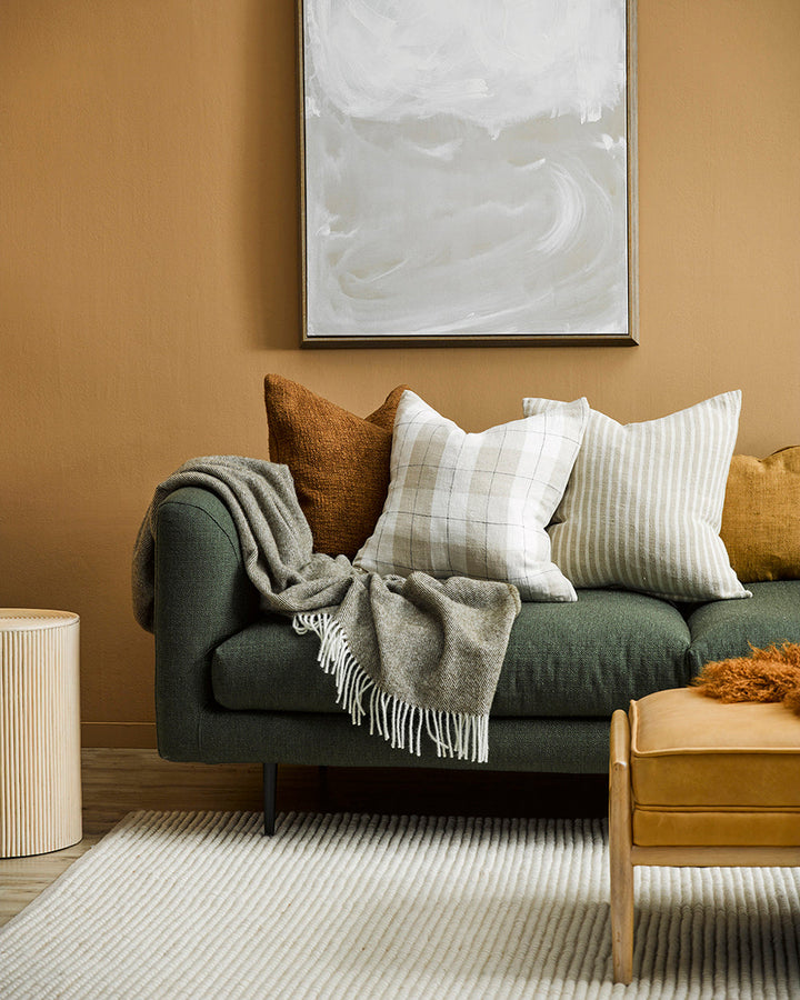 Martinborough Throw Featuring a sophisticated twill weave, classic design is celebrated in this luxurious, pure wool throw. Locally crafted from wool grown in the Hawkeâ€™s Bay, the timeless design and natural olive tone creates a reassuring sense of warm