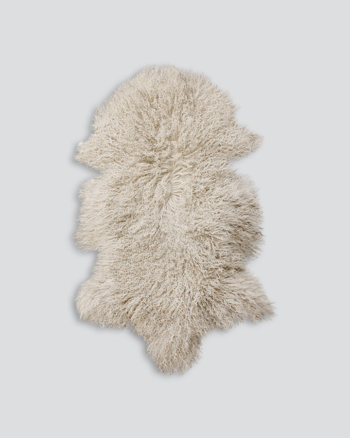 Meru Tibetan Lamb Hide Bring a warm and cosy feel to a room with the impossibly soft texture of Tibetan lamb fur. Gorgeously shaggy with a natural curl, our Meru hide adds sumptuous texture and an element of nature into your space. This restful silver ton