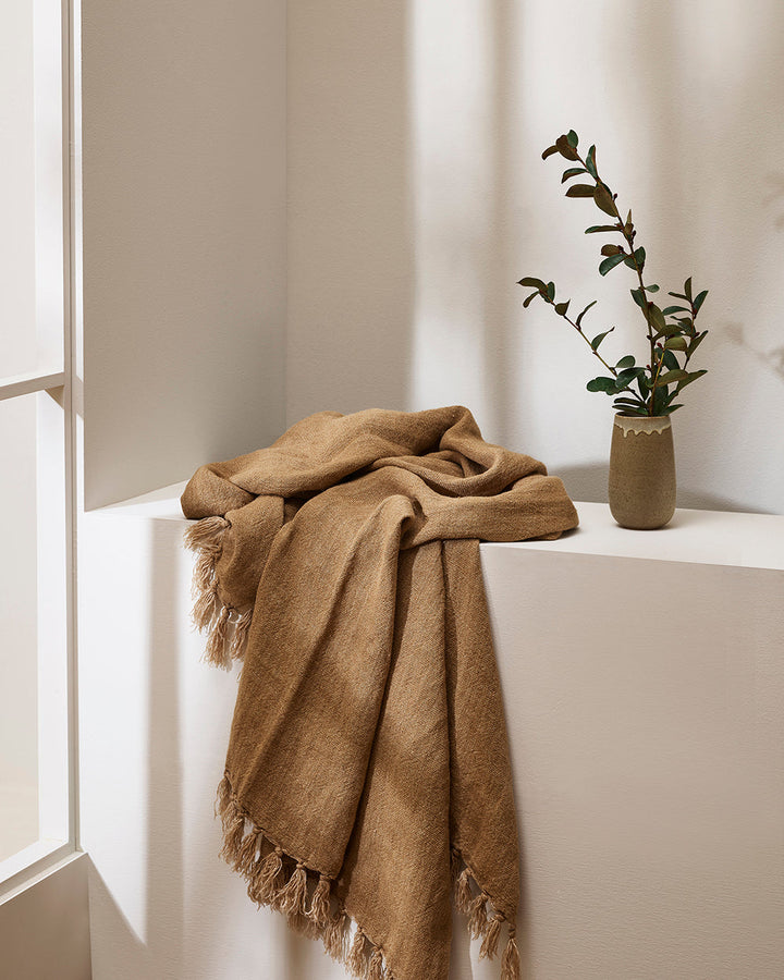 Millhouse Throw Handwoven using linen fibres that have been carefully batch-dyed to our specifications, the Millhouse’s minimal design and natural, earthy tone adds a sense of timeless elegance to spaces. Rich in character and texture, each piece is finis