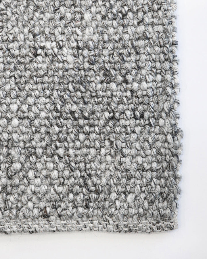 Nebraska Floor Runner Create a contemporary feel in any entrance or passageway with this simple wool-blend runner in a soft ash tone. This piece brings warmth and interest to transition spaces with its subtle mottled tone and versatile flatweave structure
