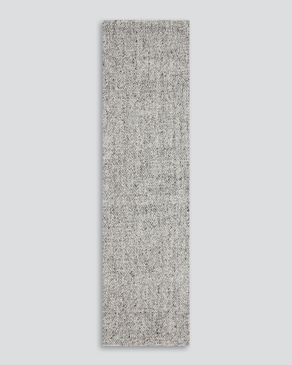Nebraska Floor Runner Create a contemporary feel in any entrance or passageway with this simple wool-blend runner in a soft ash tone. This piece brings warmth and interest to transition spaces with its subtle mottled tone and versatile flatweave structure