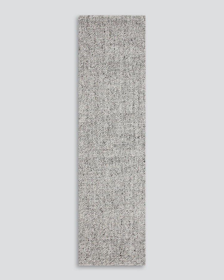 Nebraska Floor Runner Create a contemporary feel in any entrance or passageway with this simple wool-blend runner in a soft ash tone. This piece brings warmth and interest to transition spaces with its subtle mottled tone and versatile flatweave structure