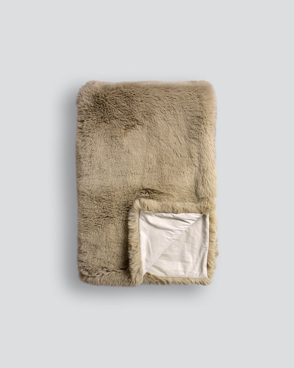 Pele Faux Fur Throw Cocoon yourself in the dense, plush pile of our Pele collection. Crafted from finely spun strands of premium faux fur, this super soft throw is designed to add a tactile, cosy aesthetic to your space. Irresistible to touch, this rich s