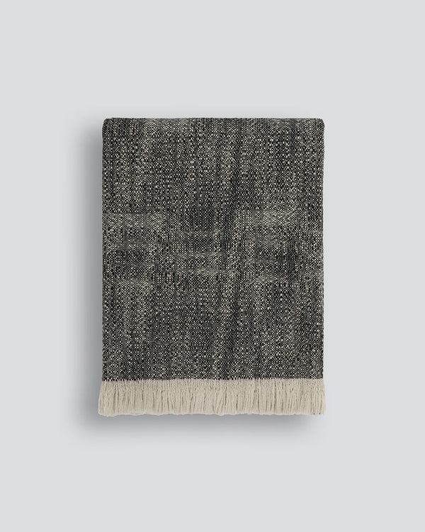 Perendale Throw Combining natural tones of ivory and charcoal, the dual-tone fibres of the Perendale creates an inviting, textural aesthetic. Handwoven from slubby strands of wool, the soft tones and medium-weight weave adds a sense of natural simplicity