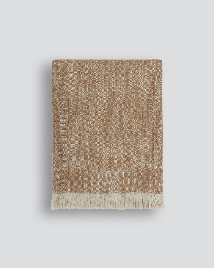Perendale Throw Combining natural tones of ivory and charcoal, the dual-tone fibres of the Perendale creates an inviting, textural aesthetic. Handwoven from slubby strands of wool, the soft tones and medium-weight weave adds a sense of natural simplicity