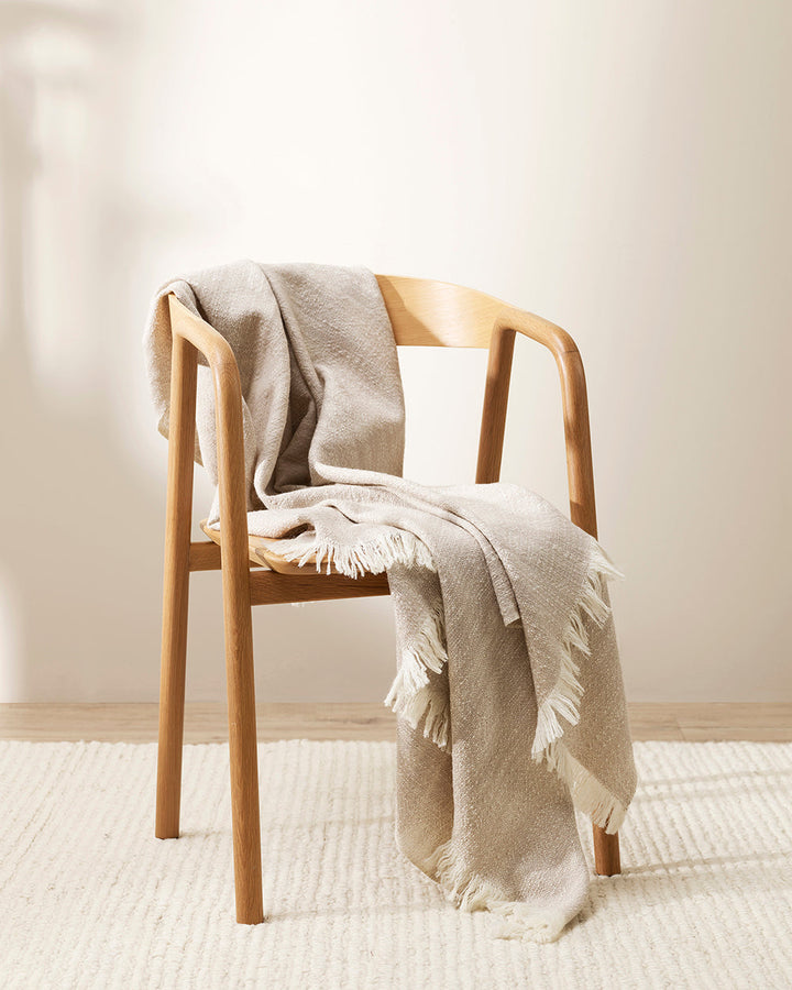 Perendale Throw Combining natural tones of ivory and charcoal, the dual-tone fibres of the Perendale creates an inviting, textural aesthetic. Handwoven from slubby strands of wool, the soft tones and medium-weight weave adds a sense of natural simplicity