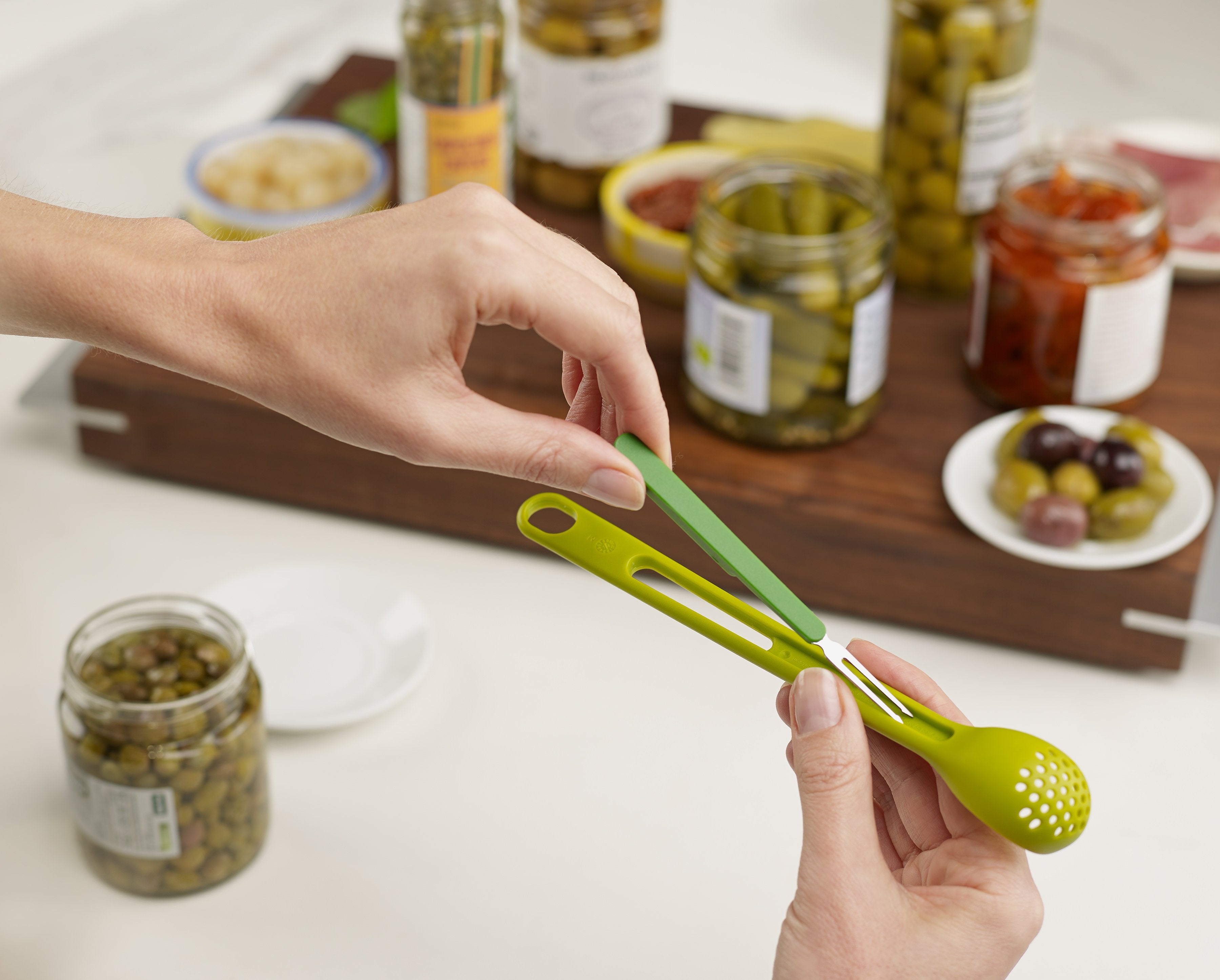 BEON.COM.AU  This handy 2-in-1 utensil makes serving antipasti easy and mess-free.  Ideal for removing olives, capers and pickles from jars Long handled slotted spoon ideal for scooping and draining from tall jars Sharp stainless-steel fork ideal for removing pickles Fork clips neatly into spoon handle for c... Joseph Joseph at BEON.COM.AU