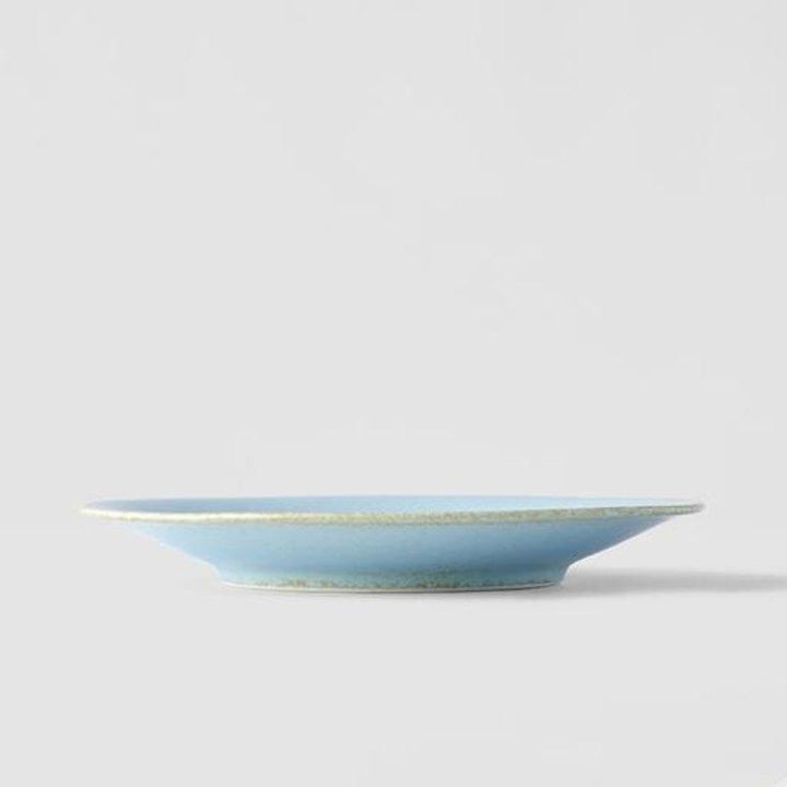 Save on Soda Blue Tapas Plate Made in Japan at BEON. 17cm diameter x 2.1cm height Tapas Plate in Soda Blue design The Soda Blue range features a soft pastel blue, highlighted by a gentle play of white. Each piece has a unique pattern determined by its position in the kiln during the firing process. Perfect as a plate to enjoy your favourite tapas, use as a side plate, or to serve with your morning or afternoon tea.Handcrafted in JapanMicrowave and dishwasher safe