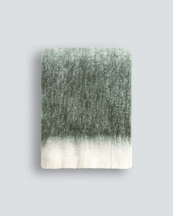 Sorrento Throw Enhance the warmth and comfort of your living space with the sumptuous addition of our Sorrento throw. Reminiscent of mohair, the brushed wool texture feels inviting and cocoon-like, while the earthy turmeric tone adds a touch of colour to