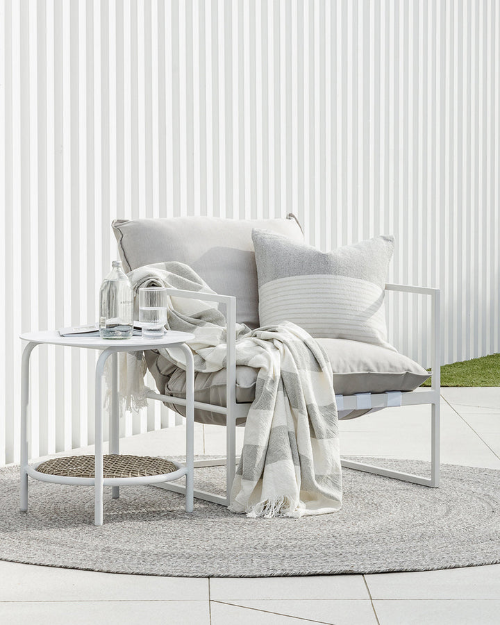 Willett Cushion Elevate your outdoors with the soft grey and white colourway of our Willett cushion. Handwoven from 100% PET yarn (a soft and supple fibre produced by recycling plastic bottles), the Willet pairs effortlessly with Corbett to create a conte