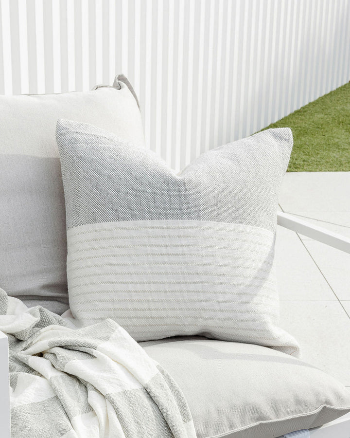 Willett Cushion Elevate your outdoors with the soft grey and white colourway of our Willett cushion. Handwoven from 100% PET yarn (a soft and supple fibre produced by recycling plastic bottles), the Willet pairs effortlessly with Corbett to create a conte