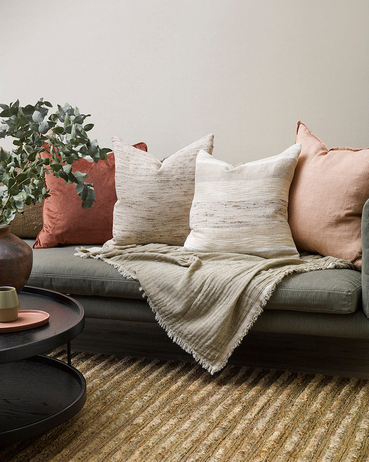 Woodrow Cushion Revive and renew through the power of simple design, handcrafted details and natural fibres. Simplicity reigns supreme in our beautifully pared-back Woodrow cushion. Raw, slubby linen is blended with cotton and silk to create a wide linear